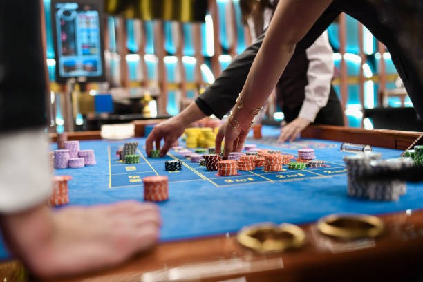 Live baccarat dealer card dealing scene